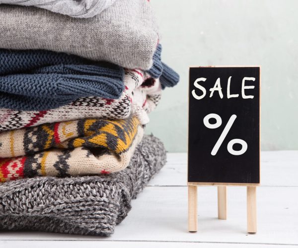 Shopping - warm sweaters and sale signboard